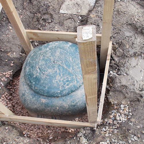 Sunken tank fitted in boggy lawn