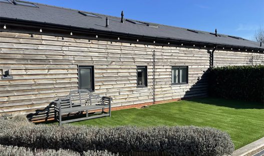 Converted barns with flattened garden